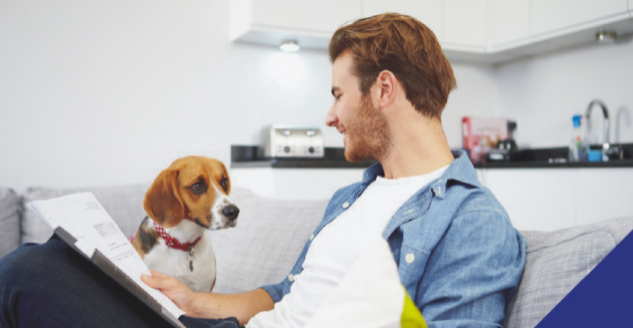 man and his dog on a sofa
